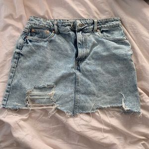 Adorable high waisted distressed denim skirt.